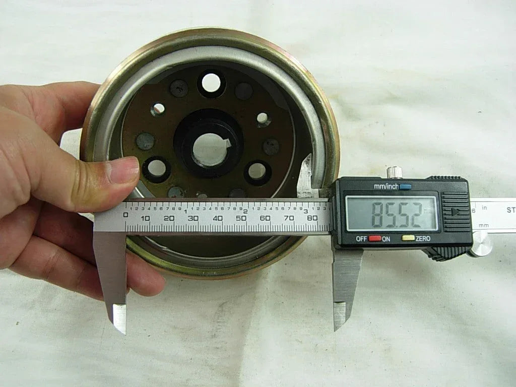 Dirt bike magneto rotor for 50cc, 110cc, and 125cc engines, compatible with various small motorcycle models.