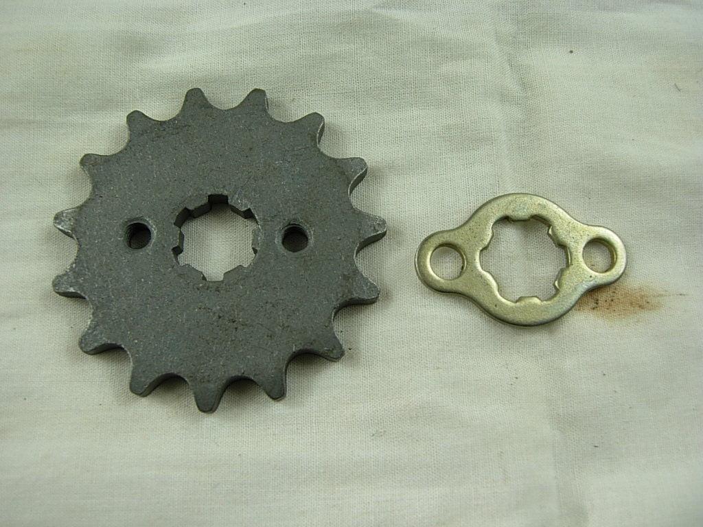 420 15-tooth engine sprocket for dirt bikes, compatible with 50cc to 125cc engines, shown in black metal.