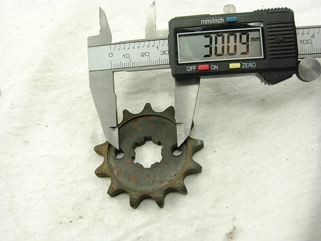 428 13-tooth engine sprocket for 50cc to 125cc dirt bikes, black metal gear component for engine performance.