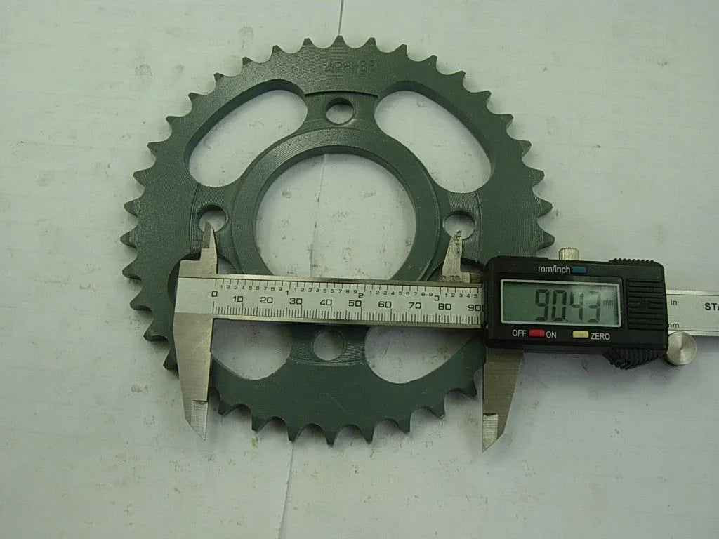Dirt bike 428H sprocket chain with front and rear wheels, part of vendor-unknown's dirt bike parts collection.