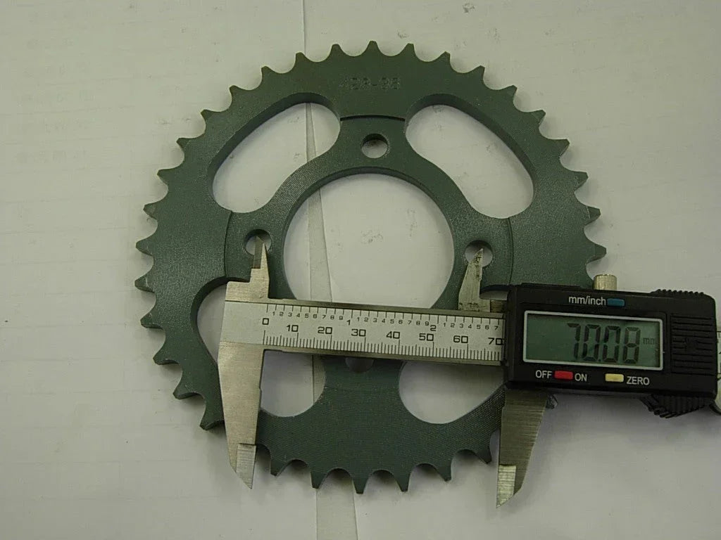 Dirt bike 428H sprocket chain with front and rear wheels, black metal parts for off-road motorcycle performance.