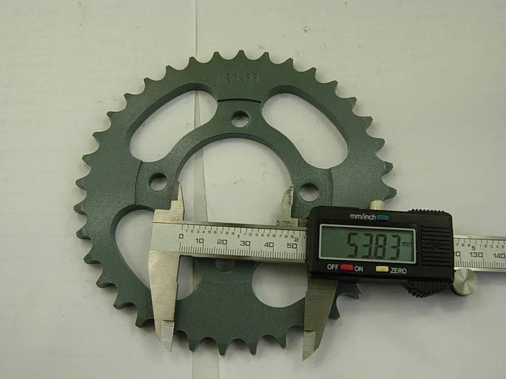 Dirt bike 428H sprocket chain with front and rear wheels, durable motorcycle parts for off-road riding.