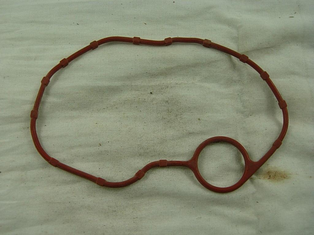 Cylinder head cover seal for CG150, 200cc, 250cc dirt bike engine from vendor-unknown, close-up of the rubber gasket.