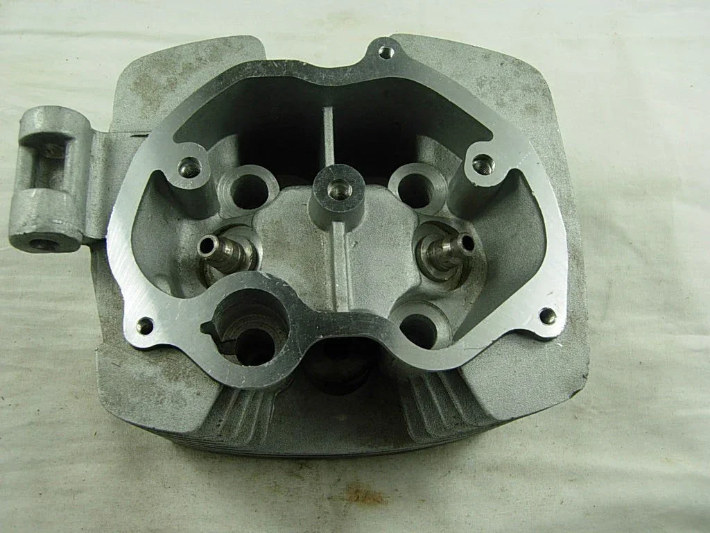 Dirt bike cylinder head for CG200cc and 163ml 200cc engines, shown with metallic finish and bolt mounting points.