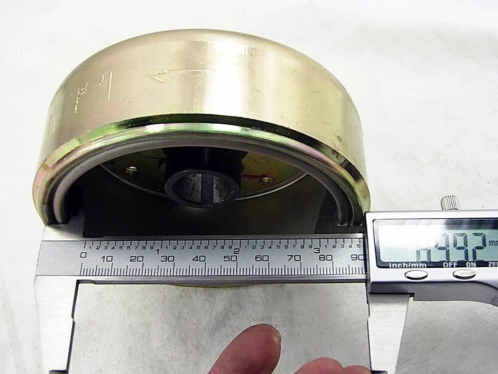 11 Magnet Rotor for GY6 125cc scooter engine, black metal part with mounting holes, used in engine ignition system.