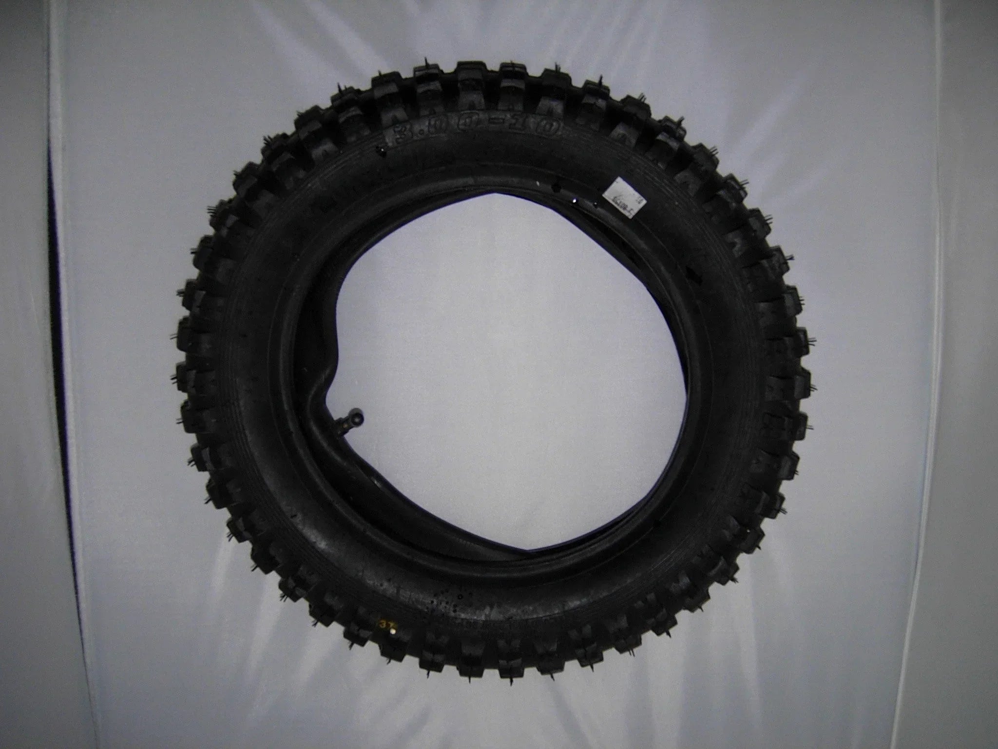 3.00-10 motorcycle tire for GY6 50CC scooters, shown in black rubber with tread pattern, suitable for scooter replacement parts.