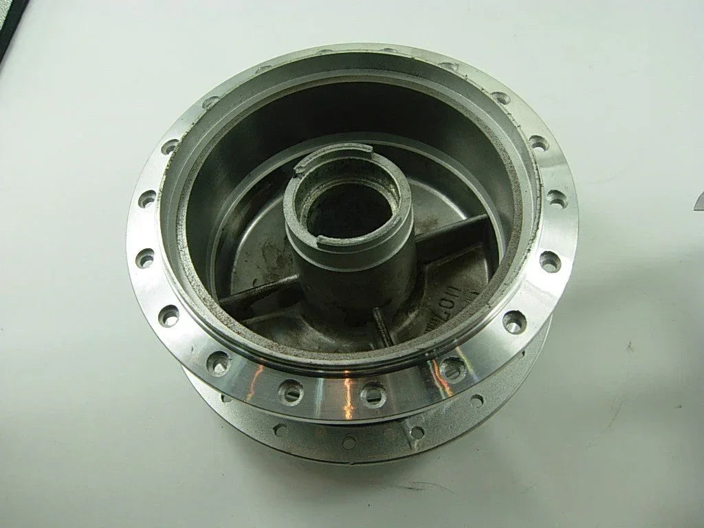 Front wheel hub for A100 engine motorcycle, showing the metal component with mounting holes and central axle hole.