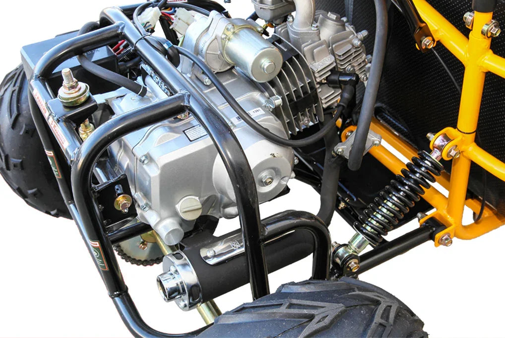 Close-up of silver Honda engine and black frame on a yellow go-kart with large rear tires and suspension