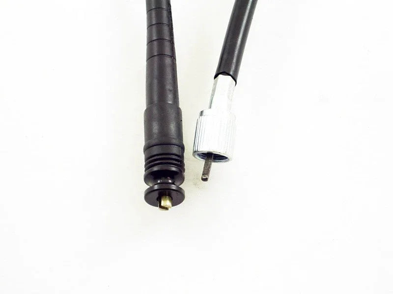 Close-up of two black cable ends with metal connectors on a white background