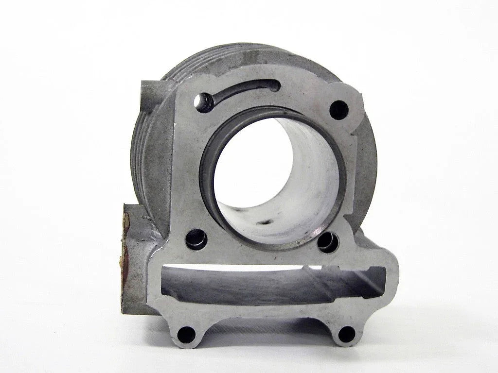 Metal engine cylinder block with circular bore and mounting holes on white background