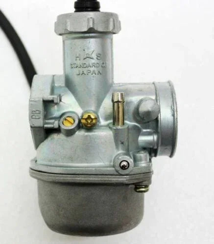 Close-up of a silver HXS Standard 01 Japan motorcycle carburetor with visible screws and attachment points