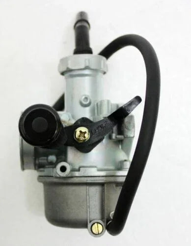 metal carburetor with black adjustment lever and attached rubber hose on white background
