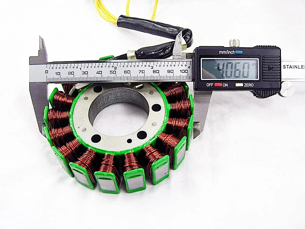 Digital caliper measuring a circular stator coil with copper wiring, showing 40.60 mm
