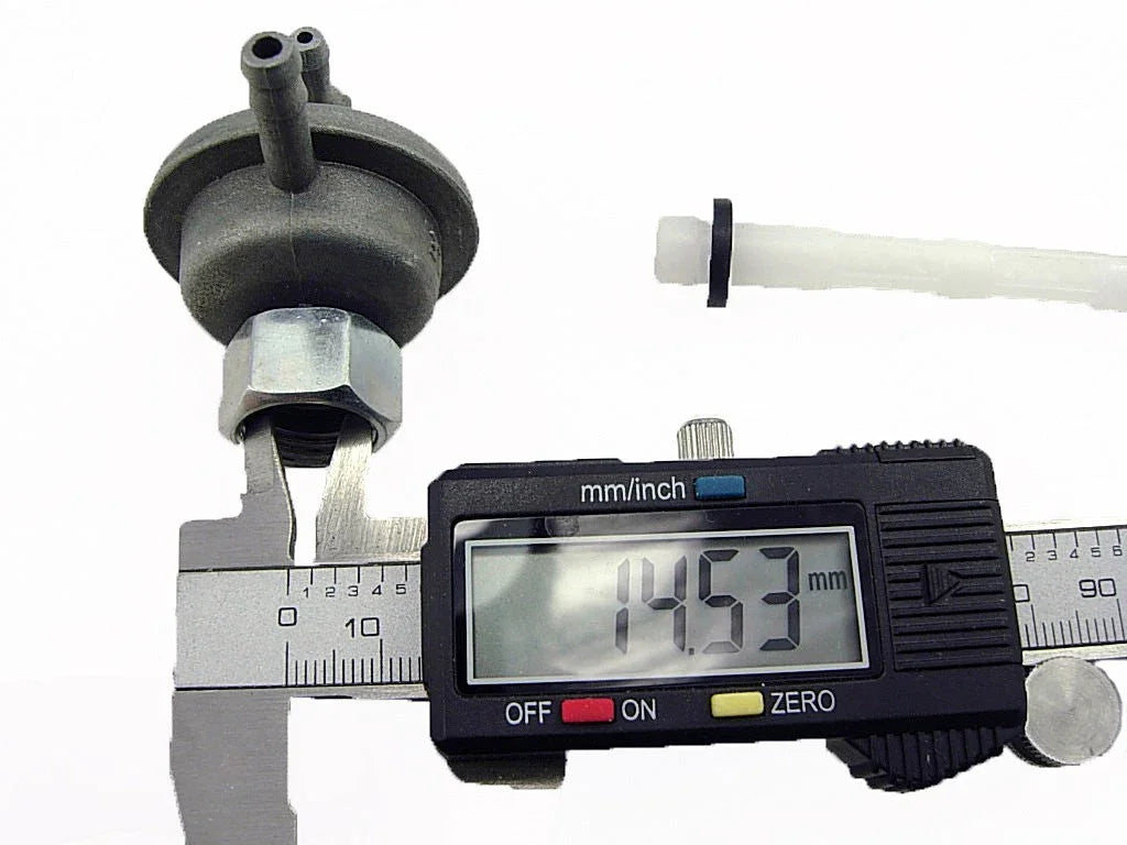 Digital caliper measuring automotive part diameter showing 14.53 mm on display