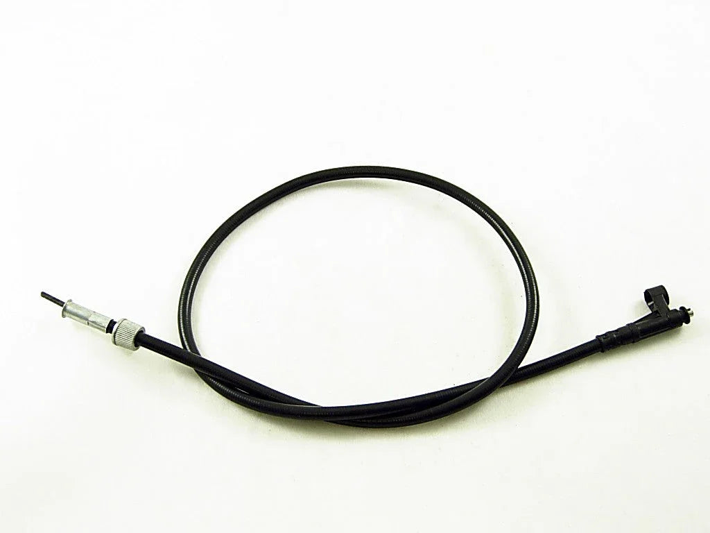 black flexible speedometer cable with metal and plastic connectors on white background