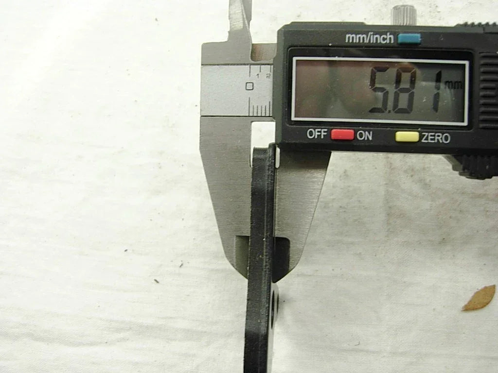 Chinese Parts USA front brake pads for 125cc motorcycles, showcasing the pad design and material texture.