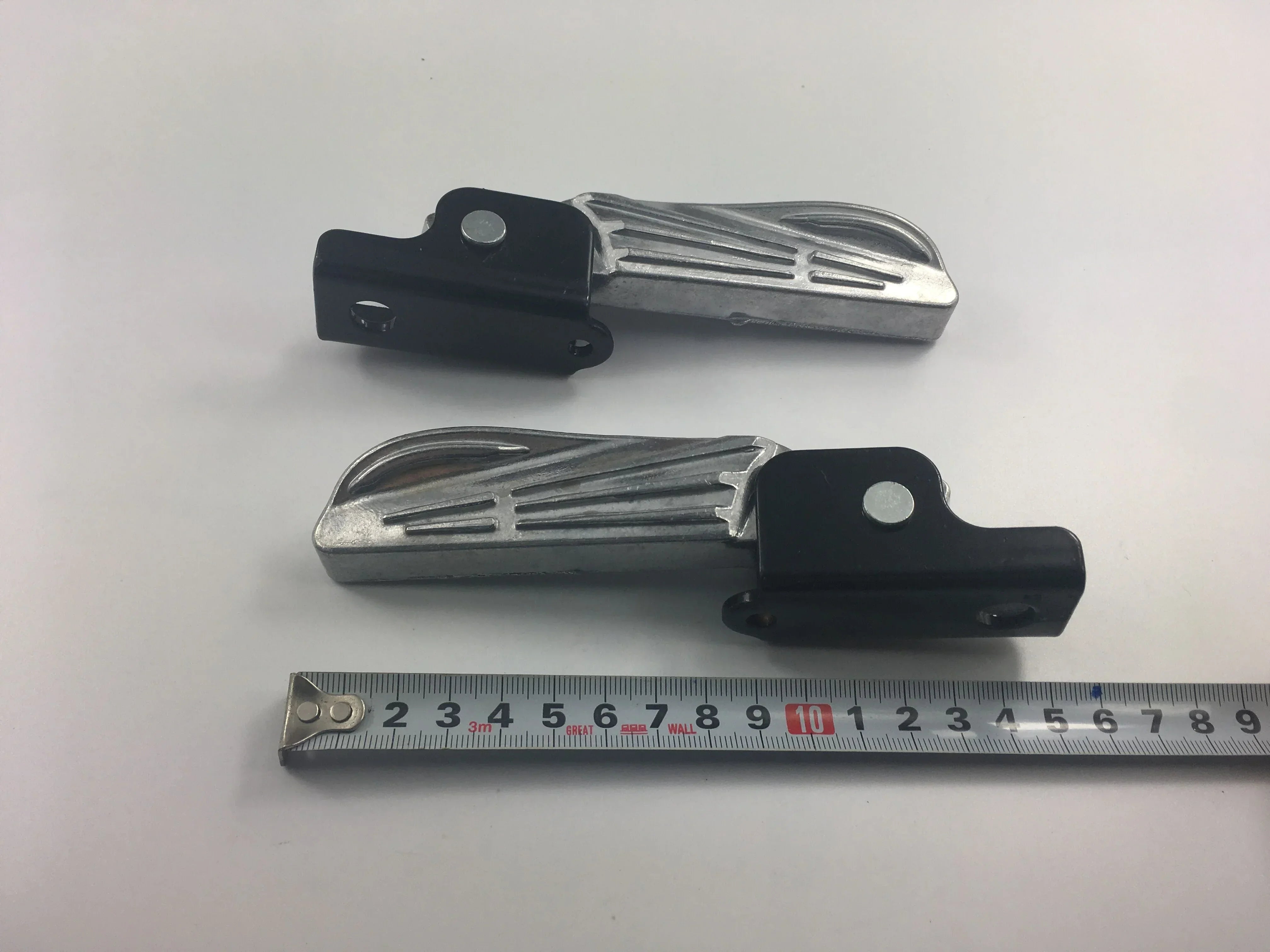 Aluminum chrome motorcycle footpegs and footrests from ChinesePartsUSA, showcasing sleek design and durable construction.
