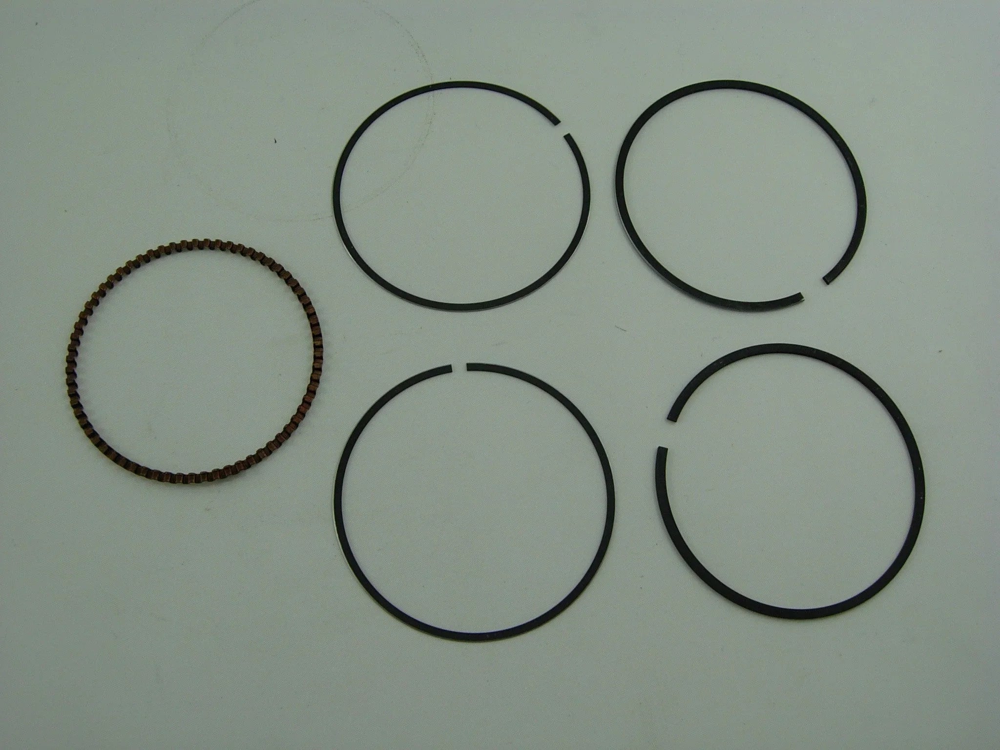 250cc CG engine piston ring set for dirt bikes from ChinesePartsUSA, includes multiple rings for engine performance.