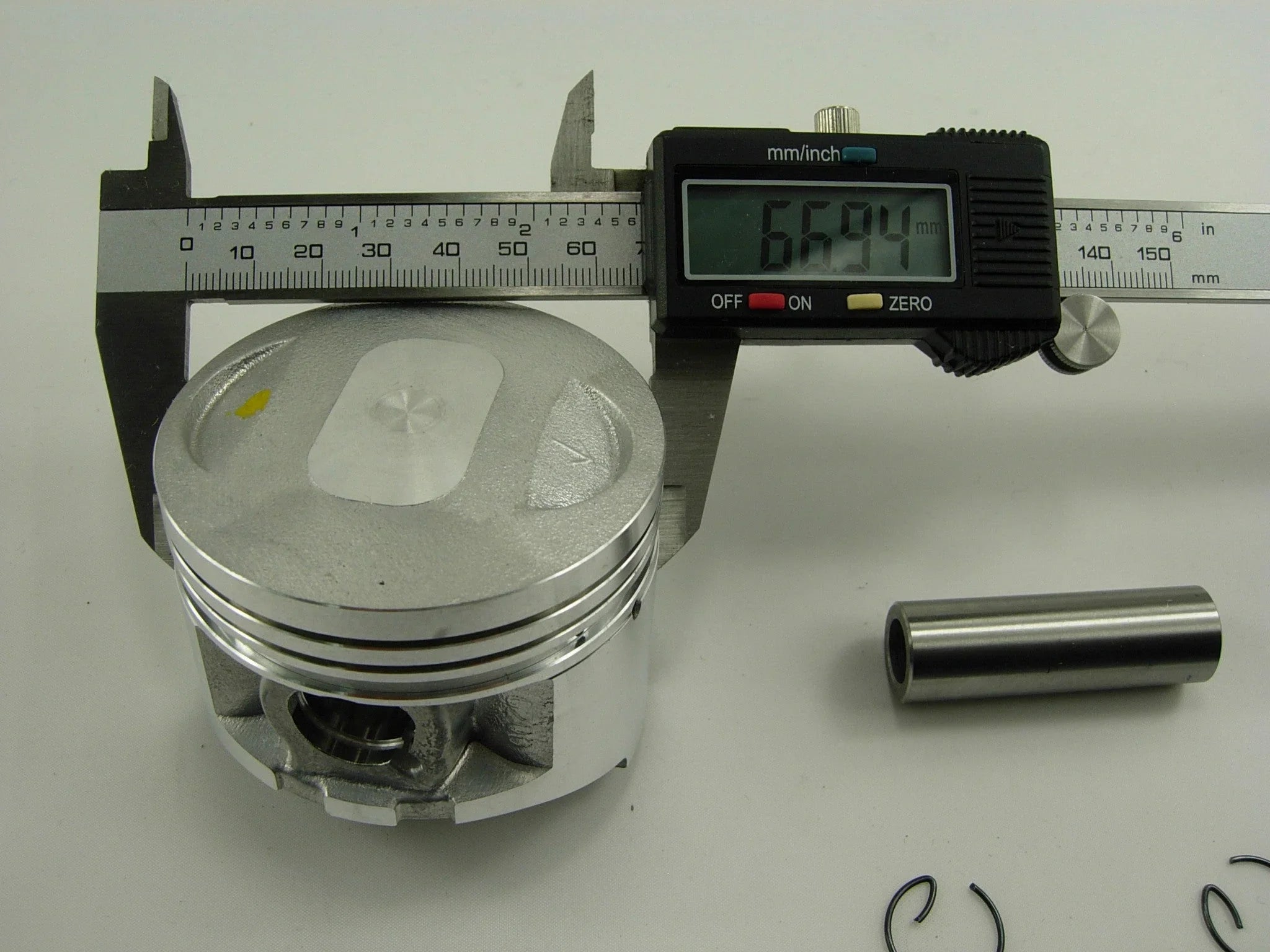 250cc CG engine piston set for dirt bikes, showing metal pistons with rings and connecting components, from ChinesePartsUSA.