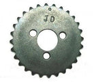 metal sprocket gear with three holes and JD engraving on silver surface