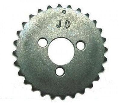 metal sprocket gear with three holes and JD engraving on silver surface