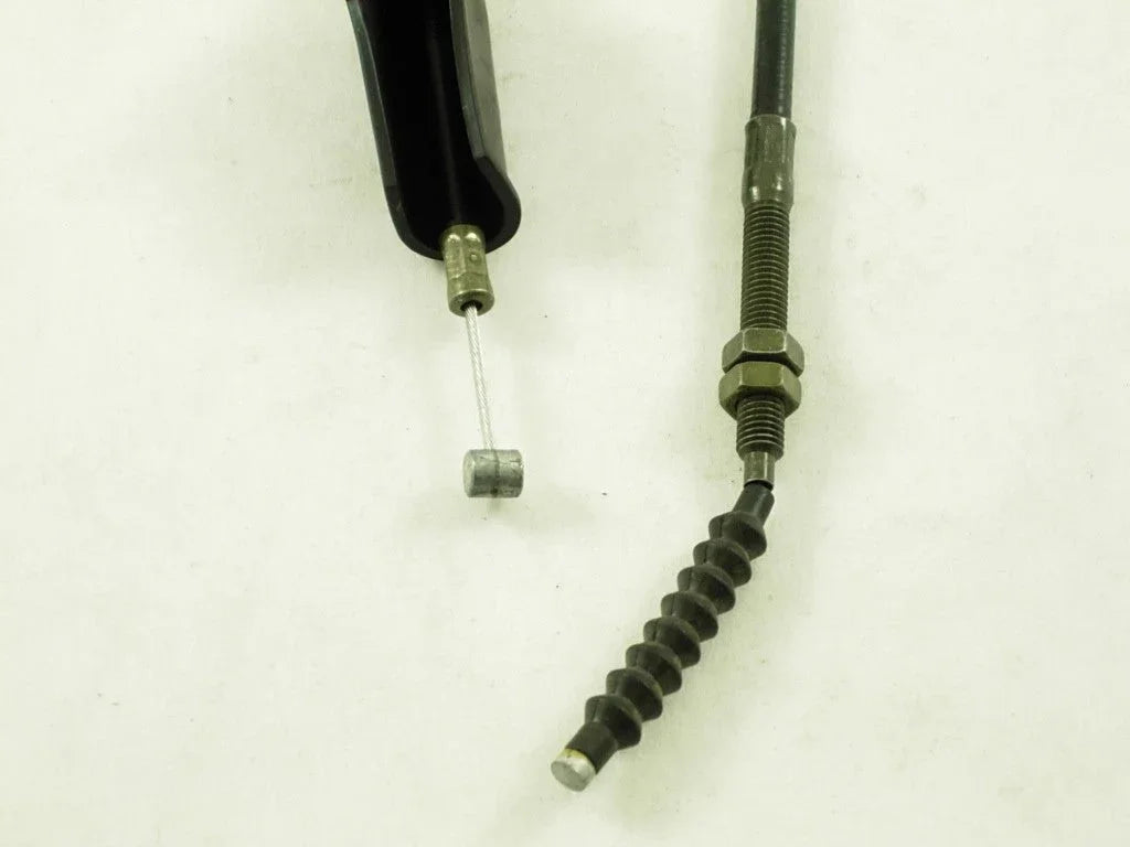 Close-up of metal cable with black plastic handle and threaded connector on white background