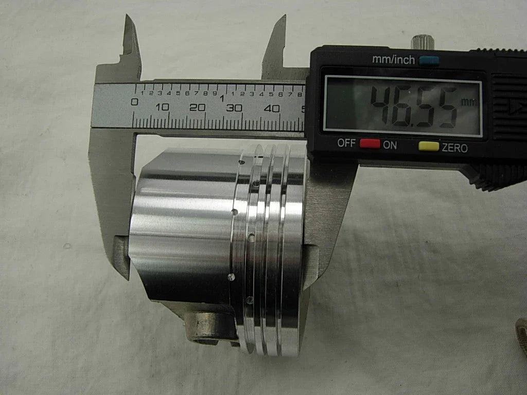67mm piston for CG250cc dirt bike from ChinesePartsUSA, showing a close-up of the engine piston component.
