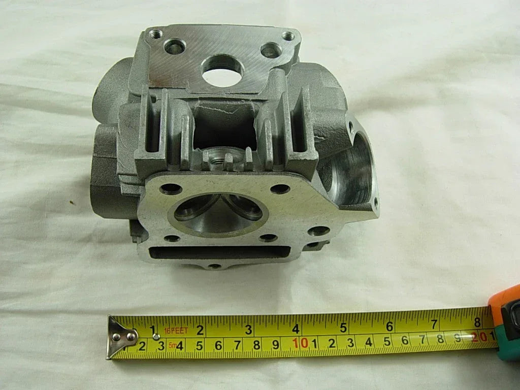 70cc 90cc E22 style engine cylinder head for dirt bikes, ChinesePartsUSA brand, showing the metal engine component with cooling fins.