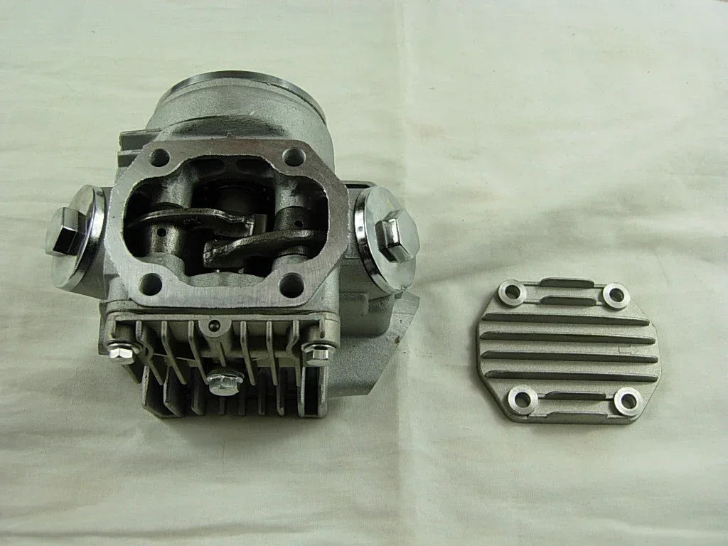 ChinesePartsUSA 70cc 90cc E22 style dirt bike engine cylinder head assembly with cooling fins and valve openings.