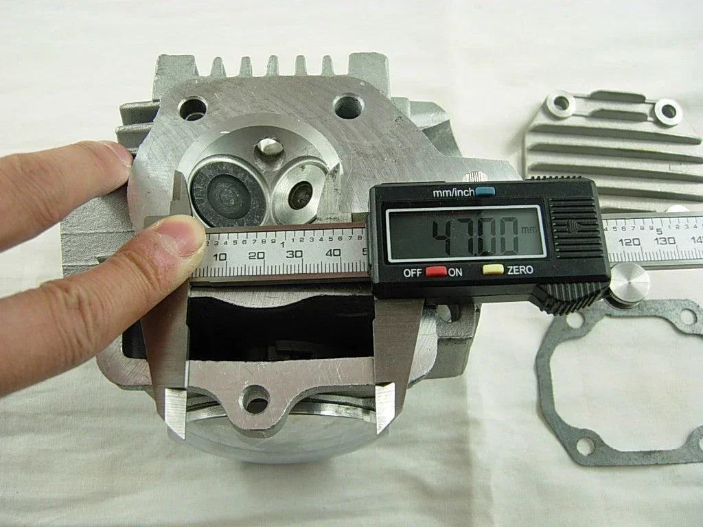 ChinesePartsUSA 70cc 90cc E22 style dirt bike engine cylinder head assembly with cooling fins and mounting points.
