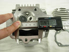70cc 90cc E22 style dirt bike engine cylinder head assembly from ChinesePartsUSA, showing the metal cylinder head with cooling fins.