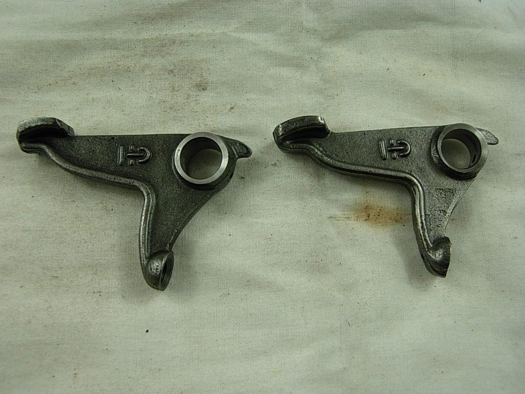 Lower rocker arm for CG150, CG200, CG250 dirt bikes from ChinesePartsUSA, showing the metal component in black with mounting points.