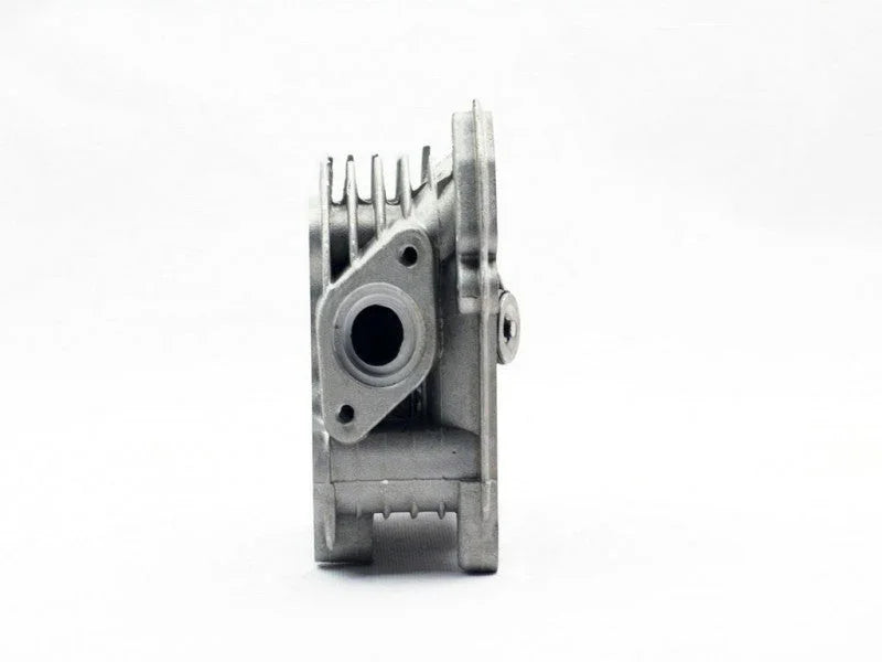 Silver metal engine part with cooling fins and circular opening on white background