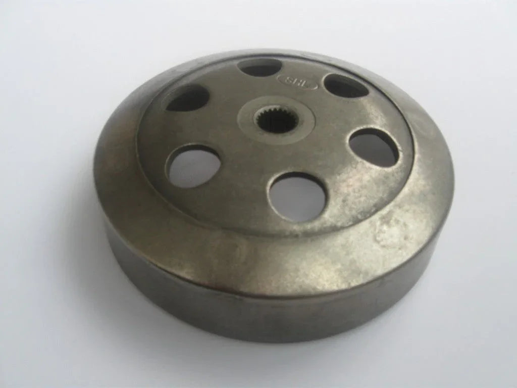Round metal clutch drum with multiple circular cutouts on white background