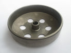 Metal flywheel with six round holes and central splined hub on white background