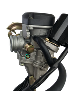 Close-up of a CVK motorcycle carburetor with metal body, black hoses, and mounting clamps