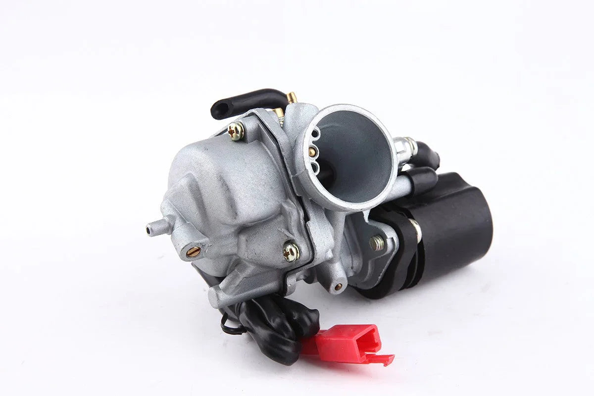 Close-up of a silver motorcycle carburetor with black wiring and a red connector on a white background
