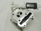 Aluminum engine cylinder head with digital caliper measuring 71.27mm, for motorcycles, ATVs, or go-karts