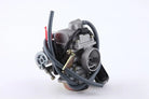 Silver motorcycle carburetor with attached throttle cables and hoses on white background