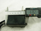 Motorcycle CDI unit box for Suzuki RM250 measured with digital caliper, showing 63.69mm.
