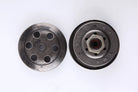 Metal clutch components with circular holes and bolt on white background