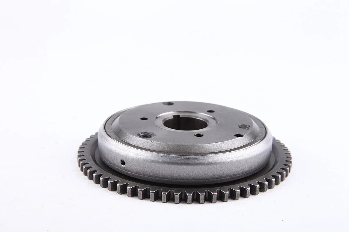 Metal automotive gear sprocket with circular holes and toothed edge on white background
