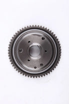 Metal gear wheel with teeth and central hole on white background