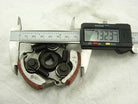 Digital caliper measuring diameter of mechanical clutch shoe assembly showing 73.23 mm on display