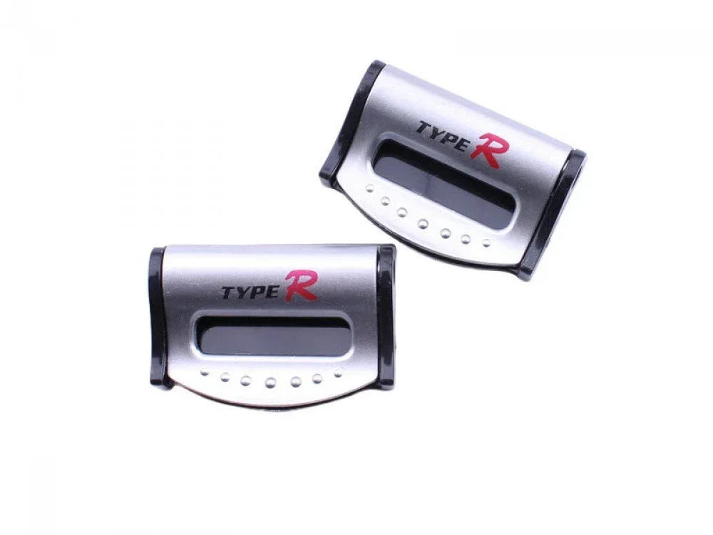 Two silver plastic safety seat belt strap buckle clips for vehicles, universal car accessories from ChinesePartsUSA.
