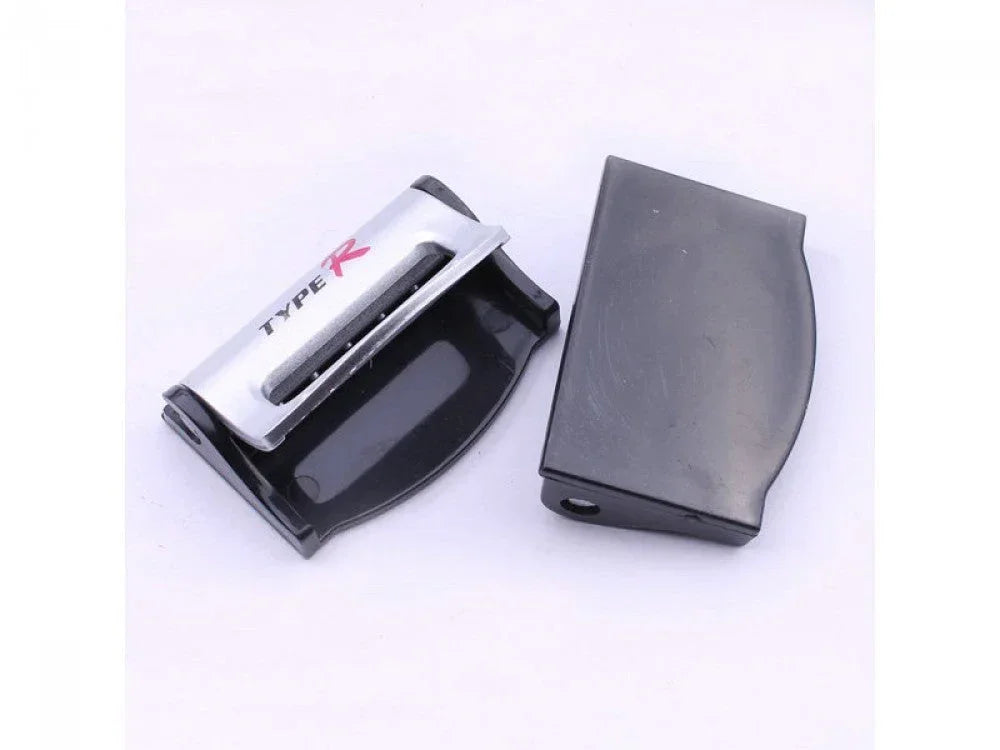 Two silver plastic safety seat belt strap buckle clips for vehicles, universal car accessories by ChinesePartsUSA.
