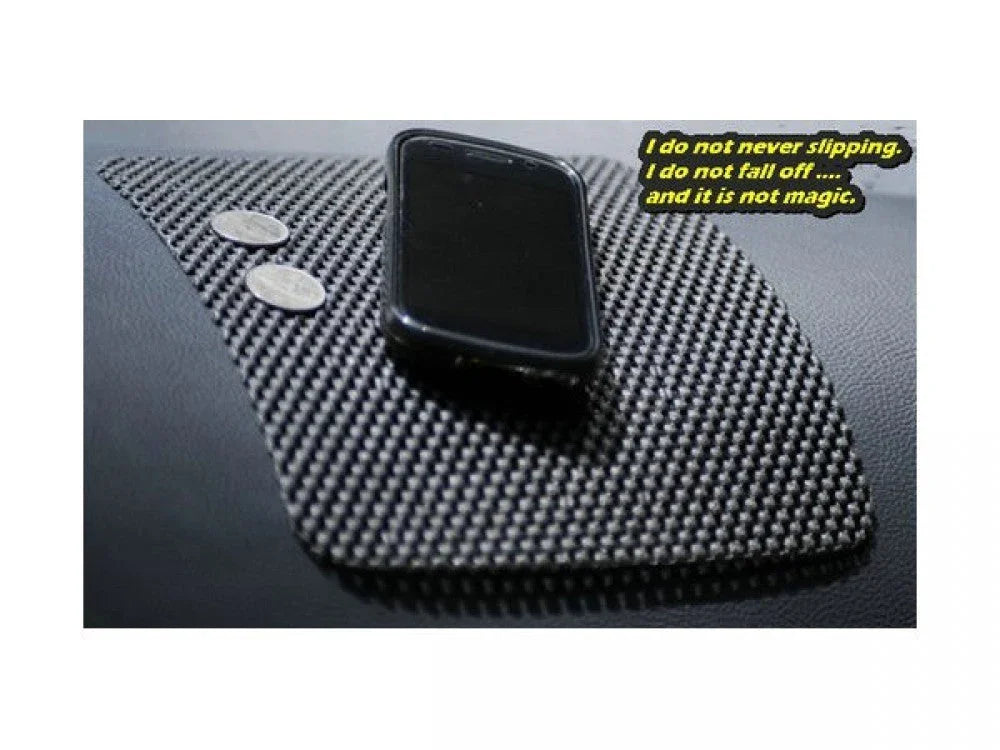 Non-slip car dashboard mat holding smartphone and coins, anti-slip accessory for vehicles