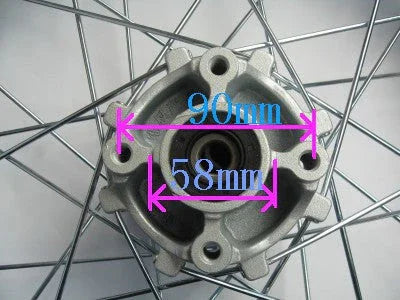 Close-up of bicycle wheel hub with 90mm and 58mm measurement labels on metal spokes and center