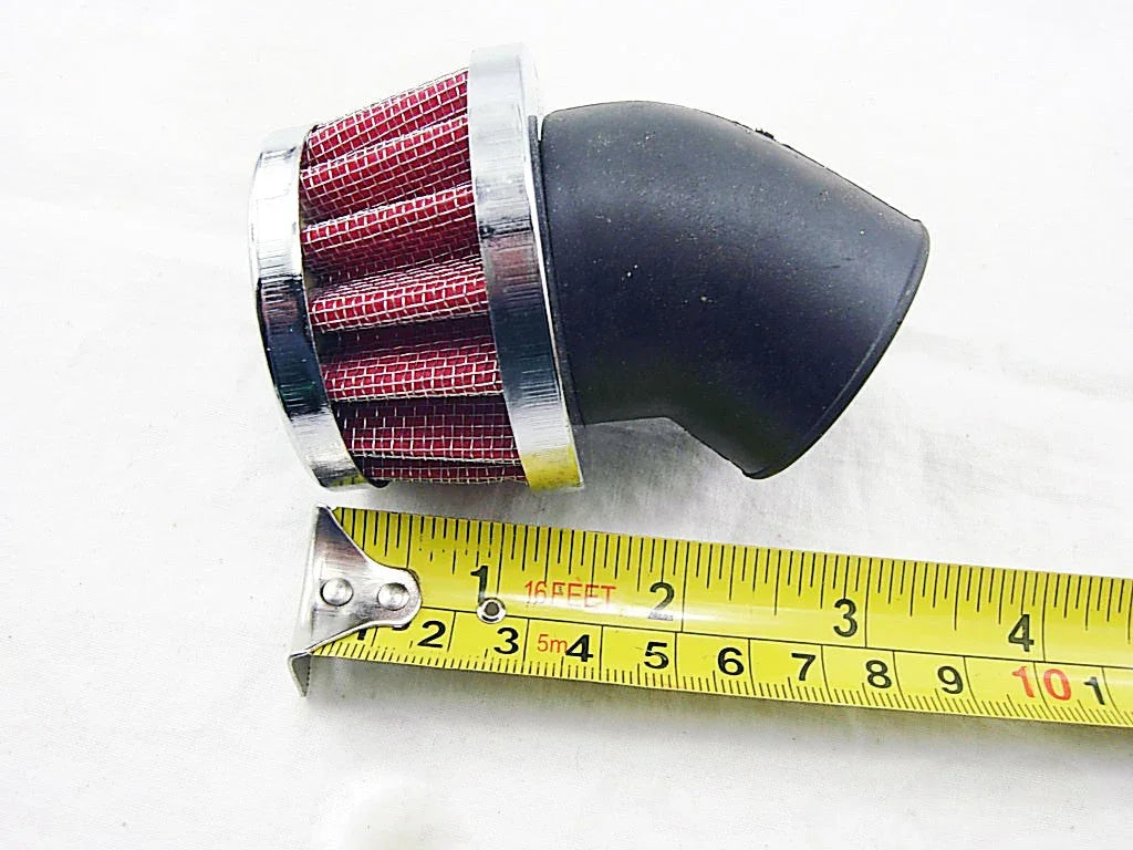 red cone air filter with chrome edge and black rubber elbow next to a yellow measuring tape