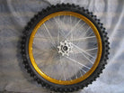 19-inch alloy front rim with tire and tube, featuring a sleek design for bicycle or motorcycle use